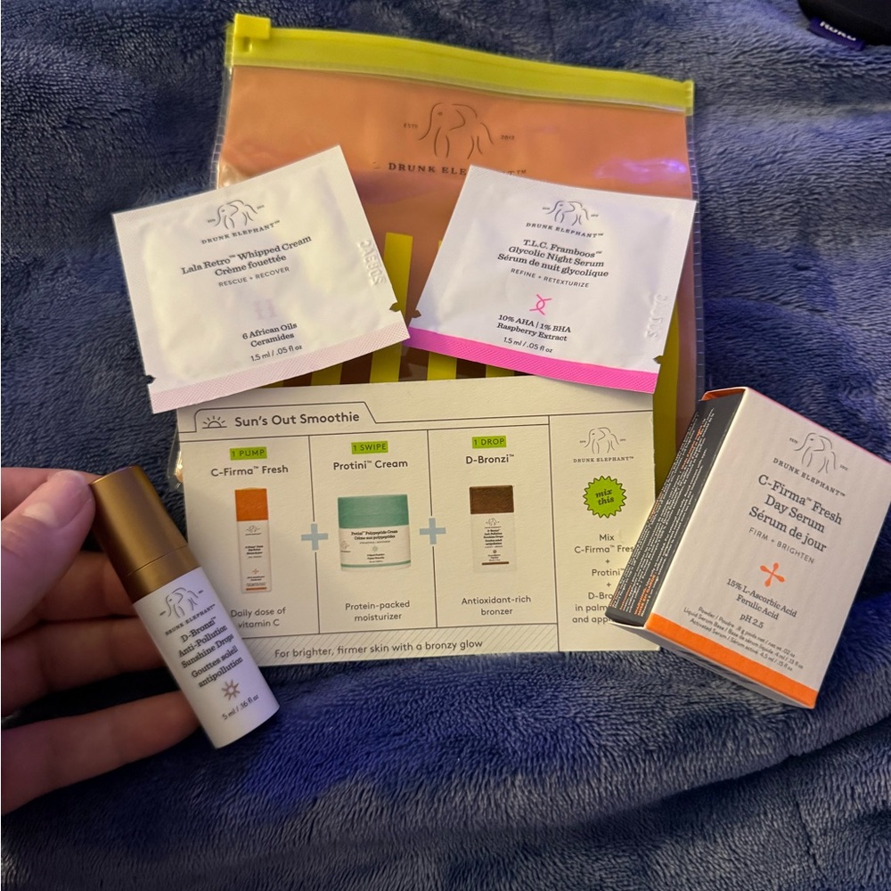 Drunk Elephant Skincare Collection with Orange and Pink Accents